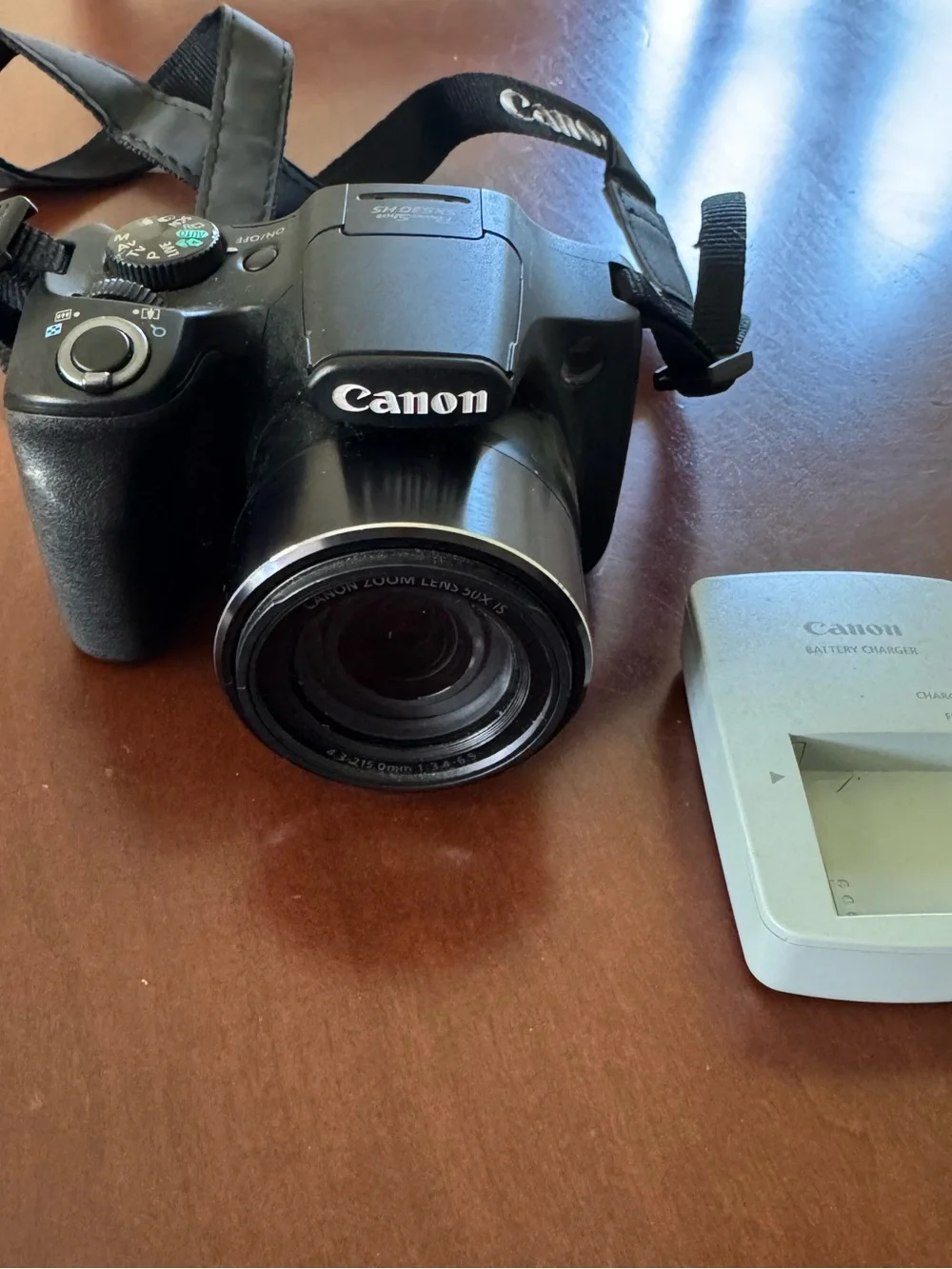 Canon Black Digital Bridge Camera with White Battery Charger